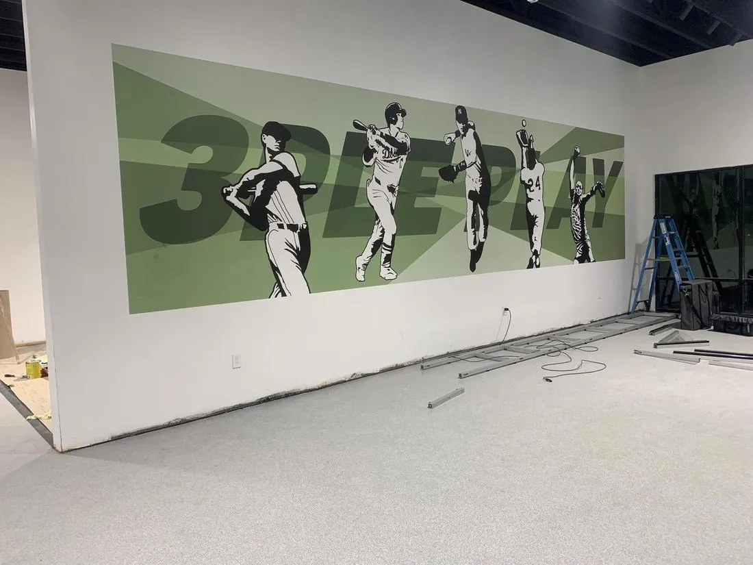 Baseball mural printed on a wall at Triple Play