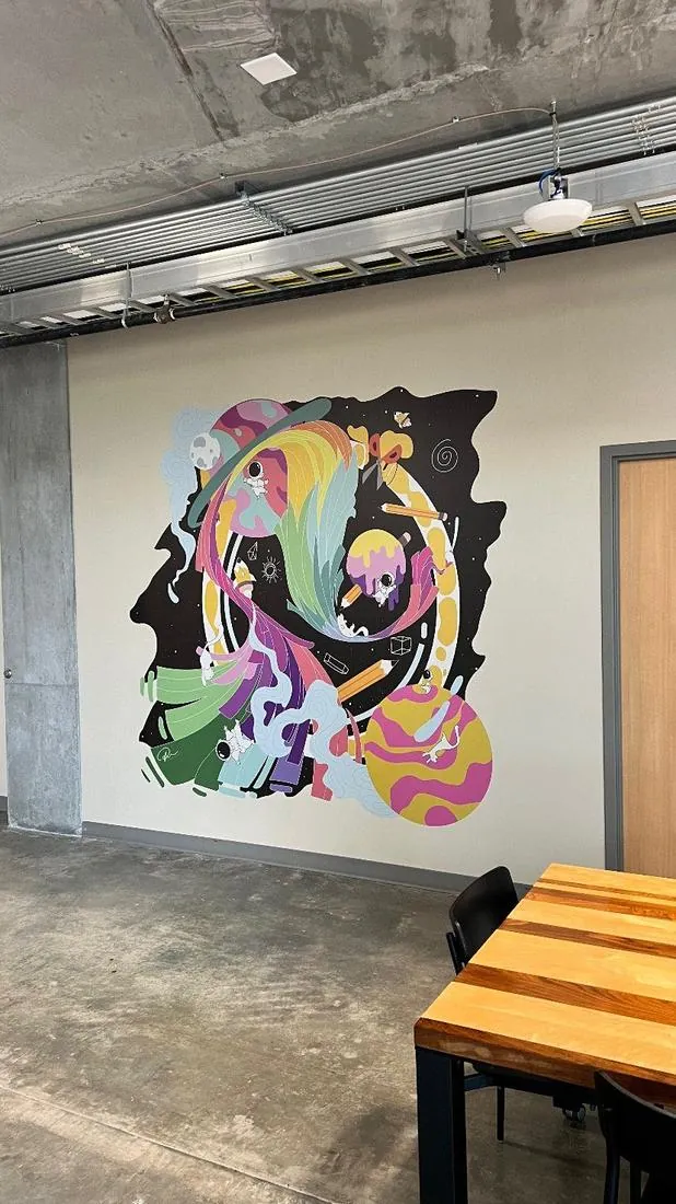 Colorful space themed mural printed on a wall at Lassonde Studios